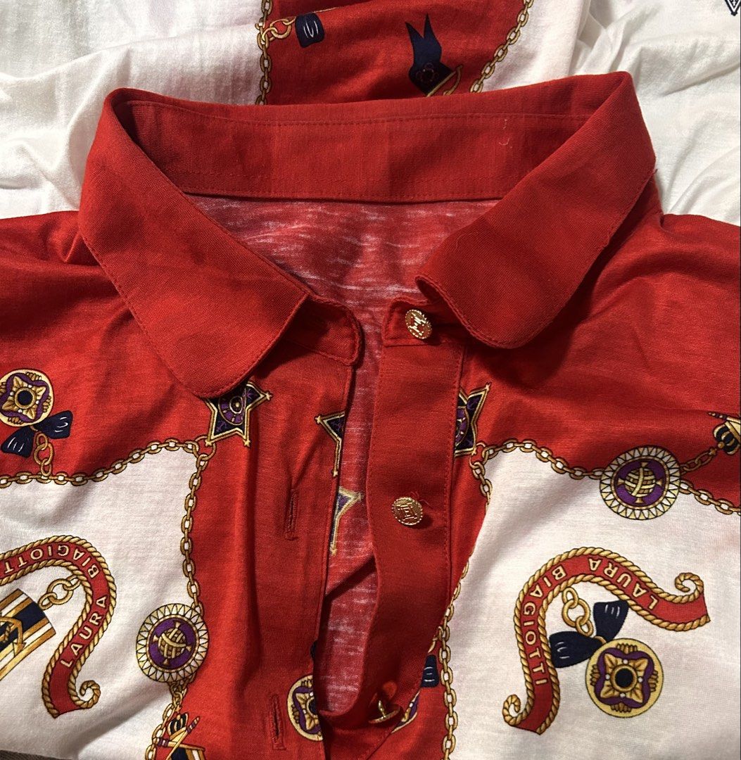 LAURA BIAGIOTTI (Category: Blouses) located in Davao. Submitted by sart0ria85 (Listing ID 1469897324, Image 3). Description: Red and white colorway with nautical chain, star, and ribbon motif; Button placket with gold-tone buttons 100% COTTON MEDIUM. Size 6 EXCELLENT CONDITION (91/100).