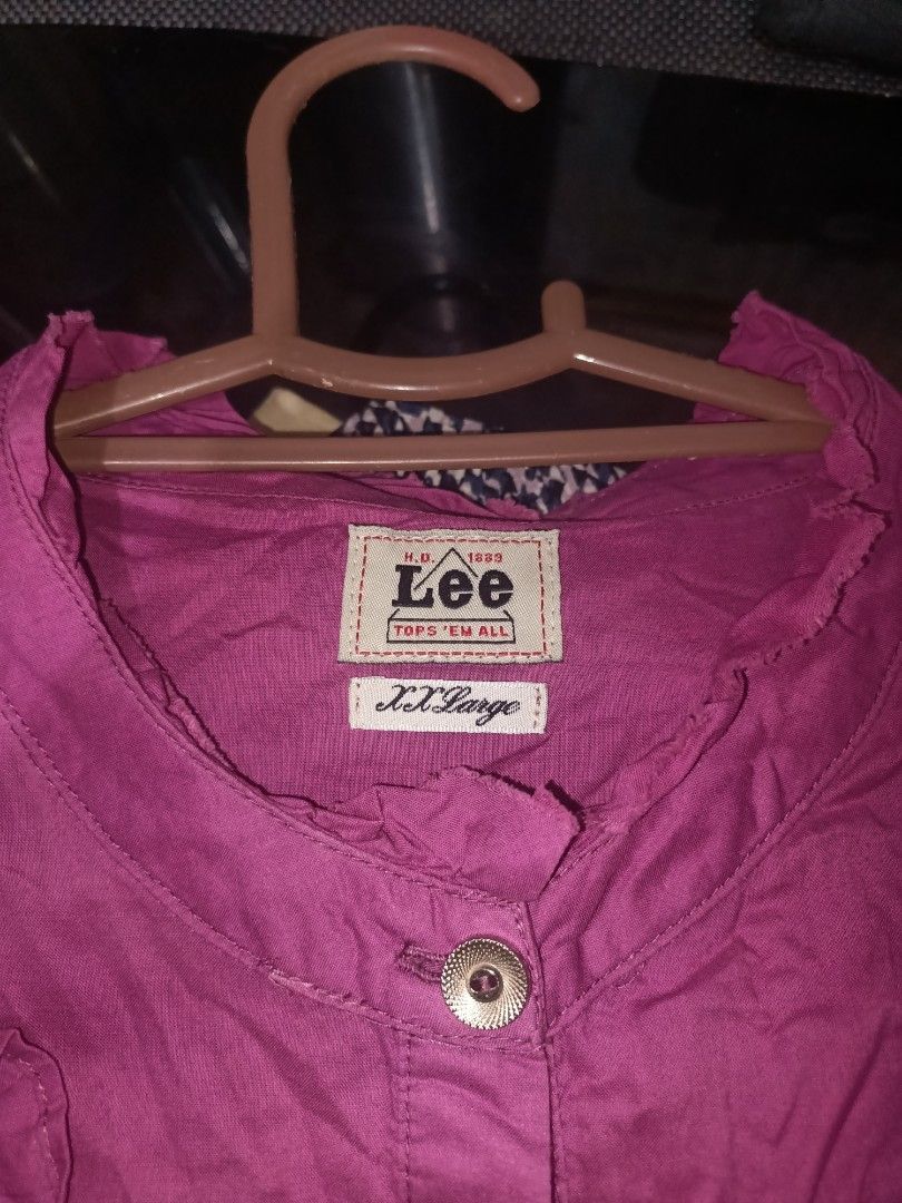 Lee's Violet Blouse (Category: Blouses) located in Manila. Submitted by clevertiger_069965 (Listing ID 1469792296, Image 2). Description: Pretty violet vintage-style Lee blouse with cute ruffle details on the front, short puff sleeves, and a button-down design. Perfect for a cute, feminine, and casual outfit! 🎀 • Brand: Lee • Color: Violet • Design: Ruffled front, button-down • Sleeves: Short puff sleeves • Condition: Pre-loved.