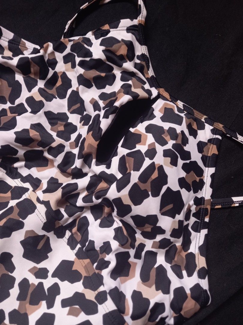 Leopard Print Halter One Piece Swimsuit (Category: Bikinis & Swimsuits) located in Manila. Submitted by ashibambum_05 (Listing ID 1469770491, Image 2). Description: - Brand/Model: Ellen Tracy One-Piece Swimsuit - Print/Pattern: Bold leopard print - Size: 12 (Tag attached) -Once lang nagamit - Design: High neck halter with thin straps and stylish front ruching - Material: Nylon and spandex shell with soft polyester lining - Condition/Use: Great fo