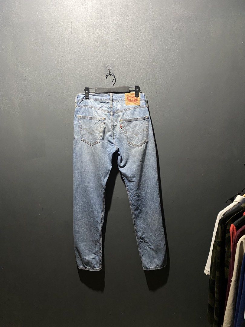 Levi's 502 Jeans W29 L32 Light Wash (Category: Jeans) located in Lucena. Submitted by handpickthrift (Listing ID 1469840372, Image 2). Description: - Brand/Model: Classic Levi's 502 Denim Jeans - Size: W29 L32 - Color/Wash: Light wash blue - Fit: Regular taper fit - Details: Five-pocket styling, contrast yellow stitching, button closure - Branding: Iconic red tab on the back pocket and leather waistband patch - Condition: Great everyday staple, r