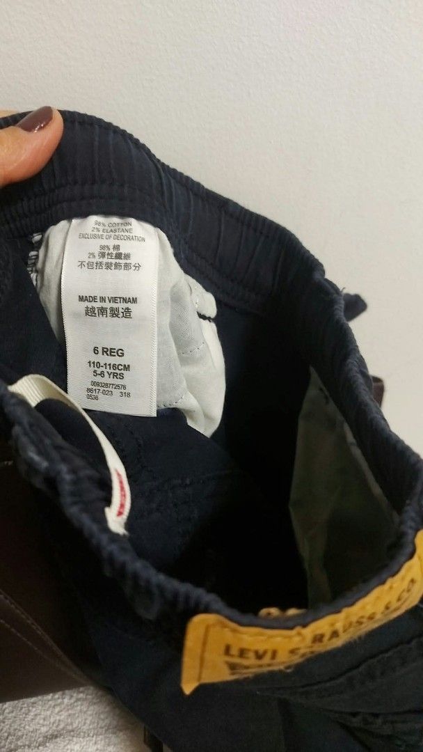 Levi's Boys Black Jogger Jeans Size 6 Regular (Category: Jeans) located in Caloocan City. Submitted by epicshark.da6ff7 (Listing ID 1469893094, Image 2). Description: - Brand: Levi's - Item: Boys Jogger Pants - Color: Dark Navy Blue - Size: 6 Regular (Fits ages 5-6 years / Height 110-116 cm) - Material: 98% Cotton, 2% Elastane - Features: Elastic waistband with drawstring, elasticized ankle cuffs, classic 5-pocket styling, and signature Levi's le