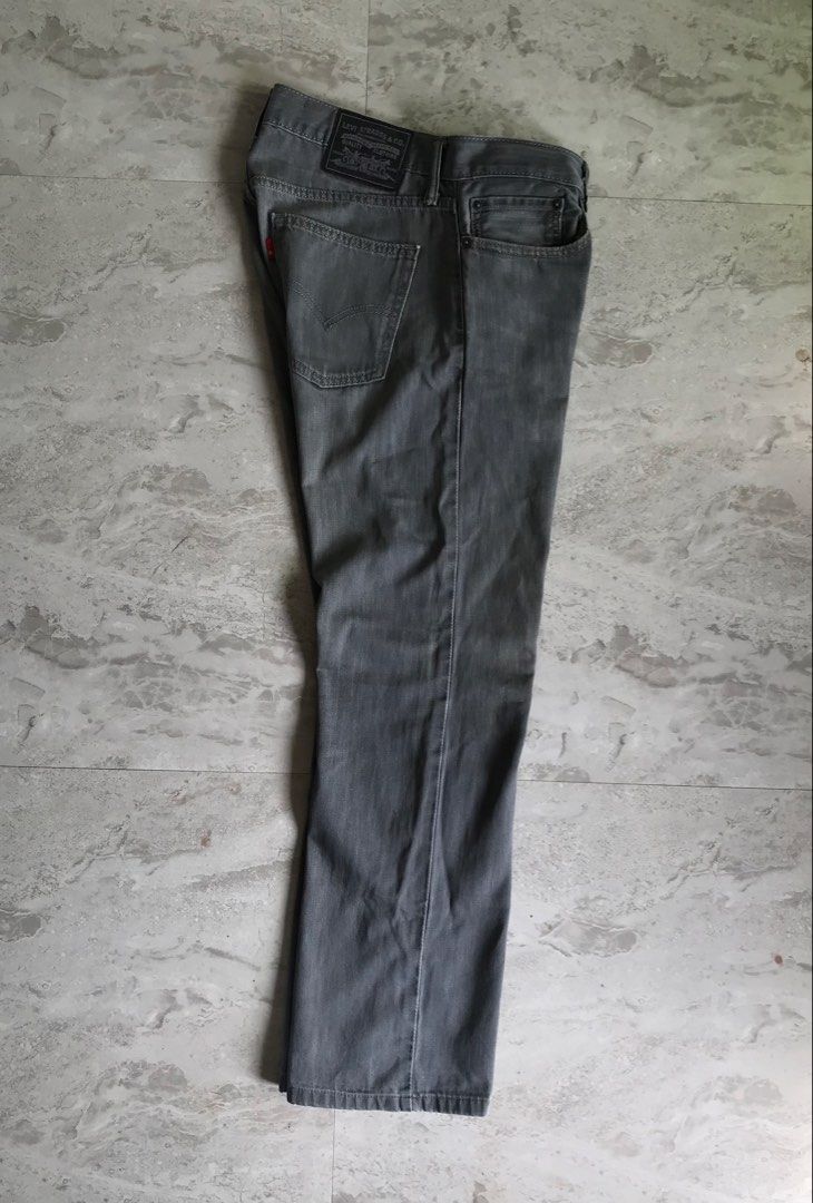 Levi's Grey Jeans W32 L32 (Category: Jeans) located in Banga. Submitted by brighthorse.b8f582 (Listing ID 1469764661, Image 2). Description: - Brand: Levi's - Color: Grey - Size: W32 L32 - Fit: Standard straight leg - Material: 100% Cotton - Closure: Button fly with branded zipper - Details: Classic 5-pocket design, leather back patch, and signature red tab - Condition: Clean wash with inner tags intact - DM for exact measurements and inquiries!.