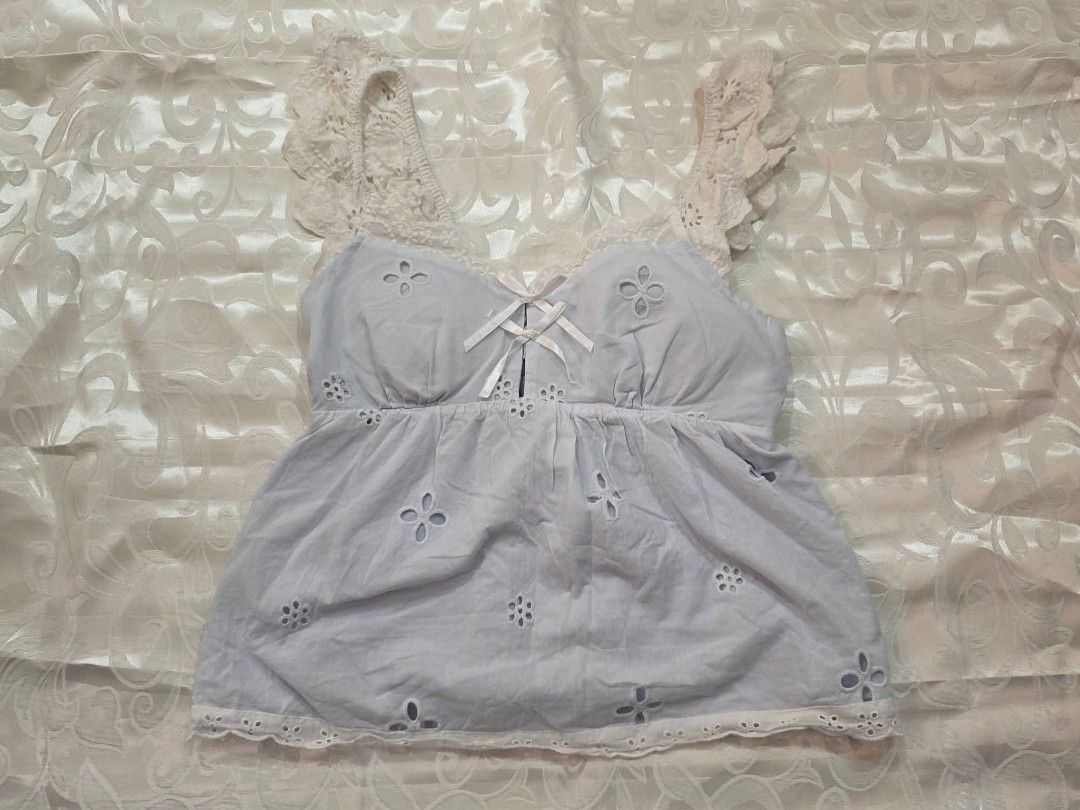 Light blue eyelet cami top with lace straps (Category: Sleeveless) located in Manila. Submitted by drieinpink31 (Listing ID 1469838489, Image 1). Description: 🎀 DRIÉ IN PINK ITEM DETAILS • Issue/Flaw: None 📦 SHIPPING • J&T Express • Shipping fee: Shouldered by buyer 💳 PAYMENT • GCash • Maya • COD: Not available 📌 PLEASE NOTE Any issues/flaws will be stated and shown in the listing. Please check the photos and details carefully before purchasi