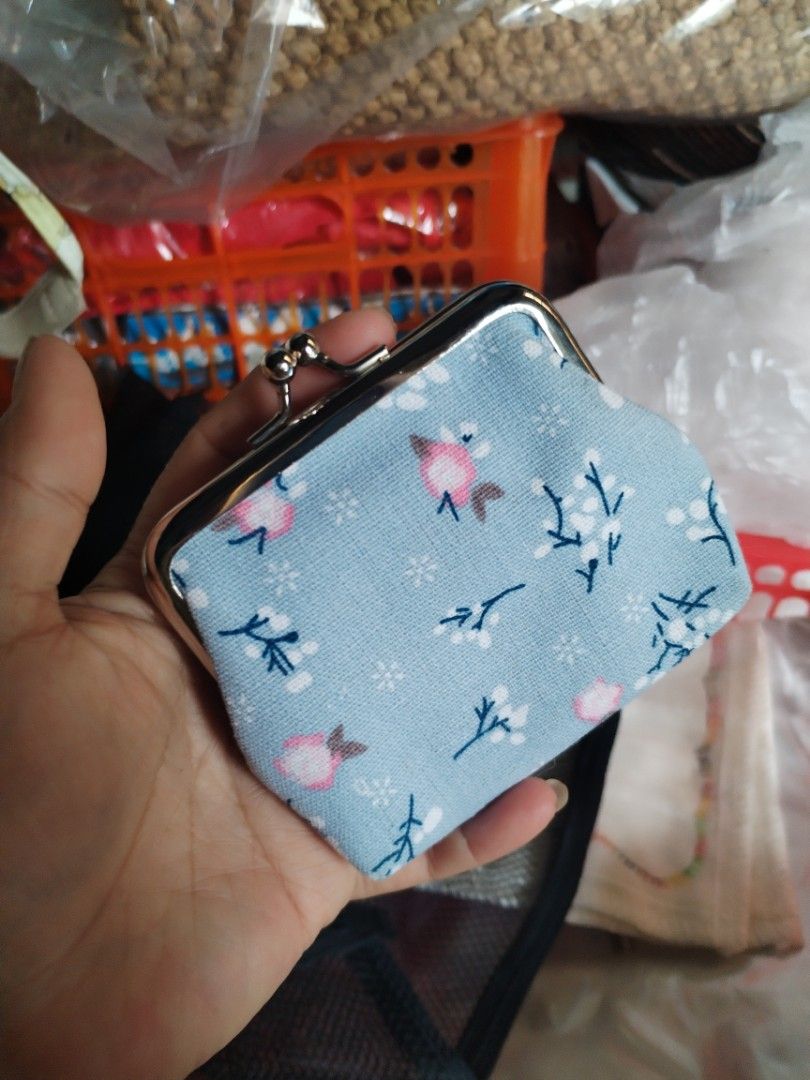 Light Blue Floral Clasp Coin Purse (Category: Purses & Pouches) located in La Trinidad. Submitted by malditas (Listing ID 1469918632, Image 1). Description: - Color & Print: Light blue with a sweet pink flower and white twig design - Closure: Shiny silver-tone metal kiss-lock clasp - Interior: Clean white fabric lining - Size: Compact and handy, fits easily in pockets or bags - Details: Neat stitching along the frame for durability From HT box BU