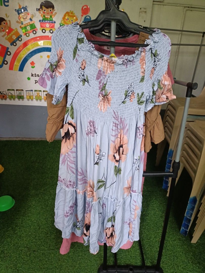 Light Blue Floral Midi Dress (Category: Dresses) located in Santa Maria. Submitted by anne_s.list (Listing ID 1469871623, Image 2). Description: - Condition: Brand new / Unused - Material: Textured cotton - Color/Pattern: Light blue with peach floral print - Fit: Smocked bodice comfortably fits small to large frames - Design details: Ruffle sleeves and tiered skirt - Style: Perfect for casual wear, dates, or weekend errands.