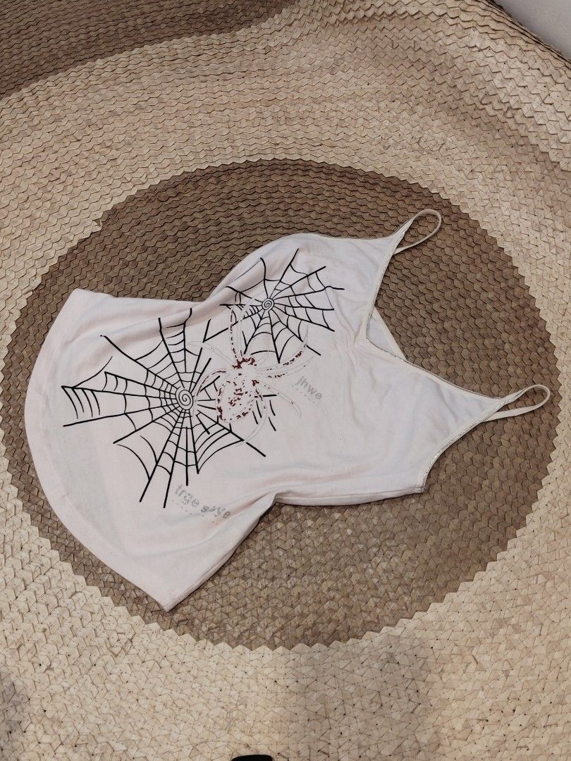 Light Pink Spaghetti Strap Camisole Tank Top (Category: Sleeveless) located in San Juan City. Submitted by rhennx (Listing ID 1469895479, Image 1). Description: - Color: Baby pink - No issue on print - Need wash (washable light stains) - Material: Soft cotton blend - Design: Thin spaghetti straps, scoop neckline - Fit: Relaxed fit, basic solid color - Versatility: Great for layering or wearing alone in warm weather.