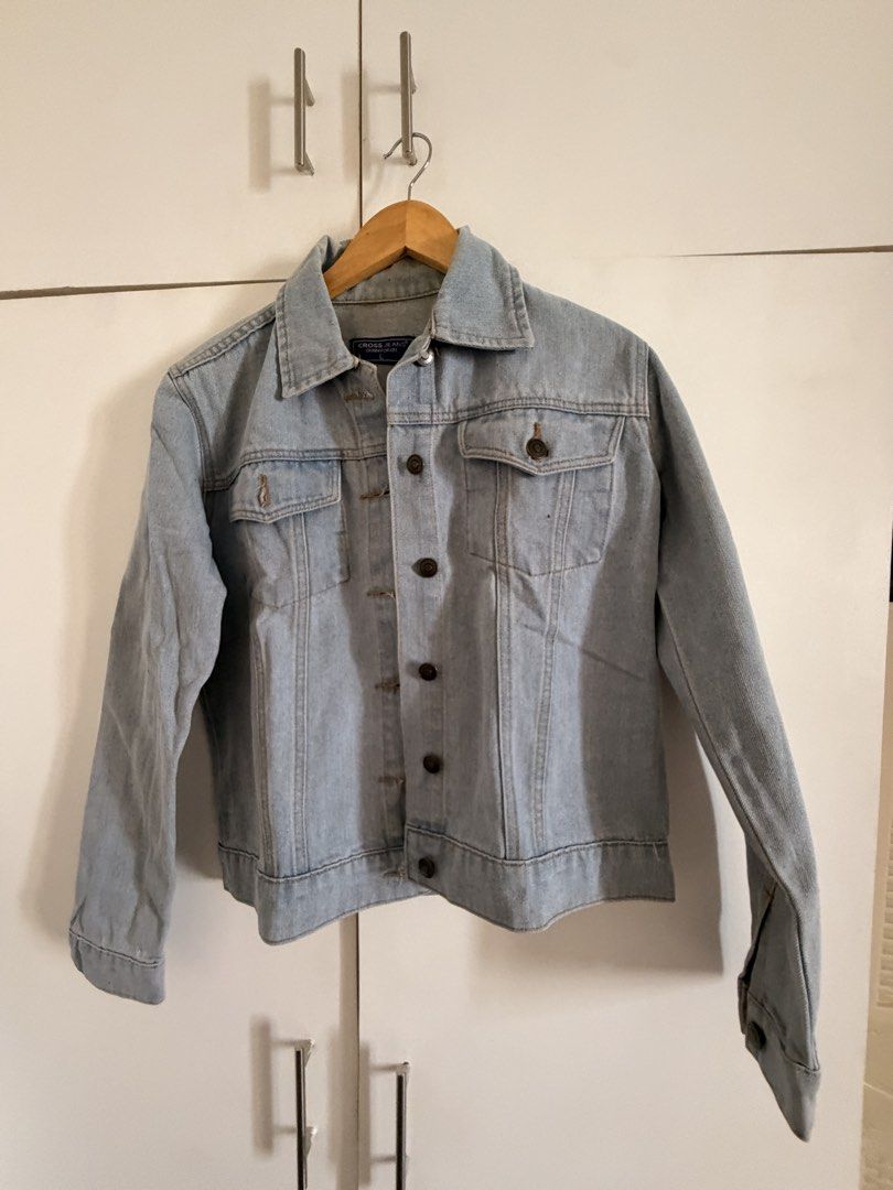 Light Wash Denim Jacket Size L (Category: Coats, Jackets and Outerwear) located in Marikina City. Submitted by _bananahanaa (Listing ID 1469803578, Image 1). Description: - Brand: Cross Jeans - Size: Large, fits small-medium - Color/Wash: Light blue - Design: Classic button-up front with dark brown buttons - Pockets: Two chest pockets with button flaps - Material: Sturdy denim, ideal for layering in cooler weather.