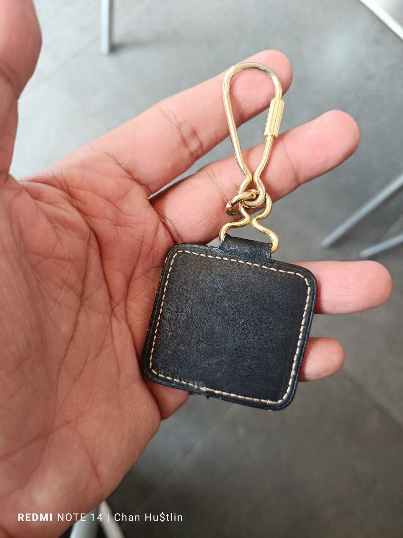 Loewe leather keychain black gold hardware (Category: Luxury Accessories) located in Calamba. Submitted by chanmagpantay (Listing ID 1469770745, Image 3). Description: - Authentic Loewe black leather keychain - Features iconic embossed Anagram logo and stylish contrast white stitching - Premium gold-tone metal hardware with a secure clip closure - Compact size, perfect for accessorizing keys or bags - Condition: Shows minor signs of use on the le