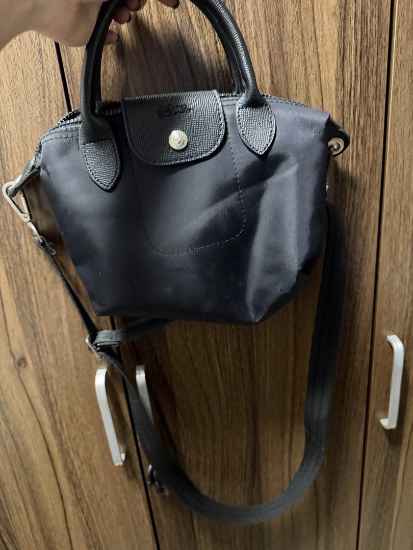Longchamp Black Nylon Crossbody Handbag (Category: Luxury Bags & Wallets) located in Quezon City. Submitted by mdjheavyequipment (Listing ID 1469854127, Image 1). Description: - Brand: Longchamp - Color: Classic Black - Material: Durable nylon - Closure: Flap with silver-tone snap button & zippered main compartment - Straps: Top handles and a detachable shoulder strap - Size: Compact, perfect for daily essentials - Condition: Excellent / Pre-love