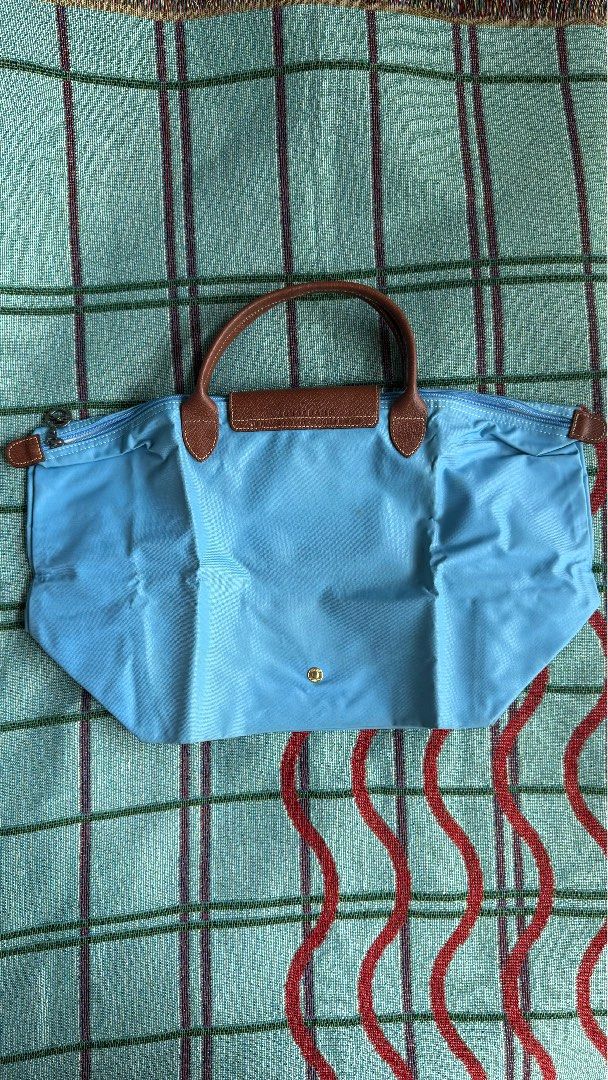 Longchamp Le Pliage Original Short Handle Tote – Light Blue (Category: Luxury Bags & Wallets) located in Quezon City. Submitted by sr.archive (Listing ID 1469797768, Image 2). Description: Classic brown leather top handle, flap, and gold-tone snap button closure Condition note: Has some spots and stains on the fabric exterior from previous use and storage (priced accordingly).