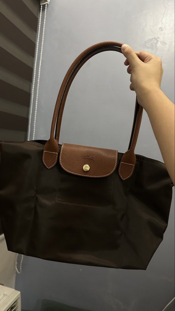 Longchamp Le Pliage Tote Bag (Category: Tote Bags) located in Manila. Submitted by bianxap_ (Listing ID 1469789220, Image 1). Description: Longchamp Le Pliage Bag - Auth - Medium, Long Handle - Ebony Brown - Comes in ziplock bag - Bought in Zalora Pm for more details 📍Bacoor Cavite.