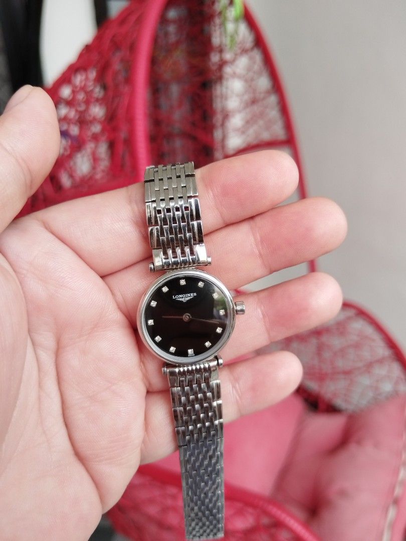 Longines La Grande Classique (Category: Luxury Watches) located in Tarlac. Submitted by gjsma29 (Listing ID 1469765912, Image 2). Description: The watch in the image is a Longines La Grande Classique (model L4.209.4.58.6), featuring a 24 mm stainless steel case, a black lacquered polished dial, diamond dot hour markers, and a matching stainless steel bracelet..