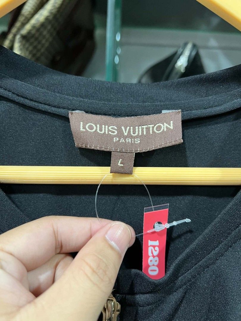 Louis Vuitton Black Zip Front Dress Size L (Category: Dresses) located in Urdaneta. Submitted by jayceegarage (Listing ID 1469903184, Image 2). Description: - Brand: Louis Vuitton - Color: Black - Size: Large (L) - Material: Premium cotton-polyester blend - Design: Half-zip front with gold-toned double zippers, round neckline, structured seams, and two front pockets - Condition: Brand new with tag attached (Red Label #1280) - Perfect for smart-ca