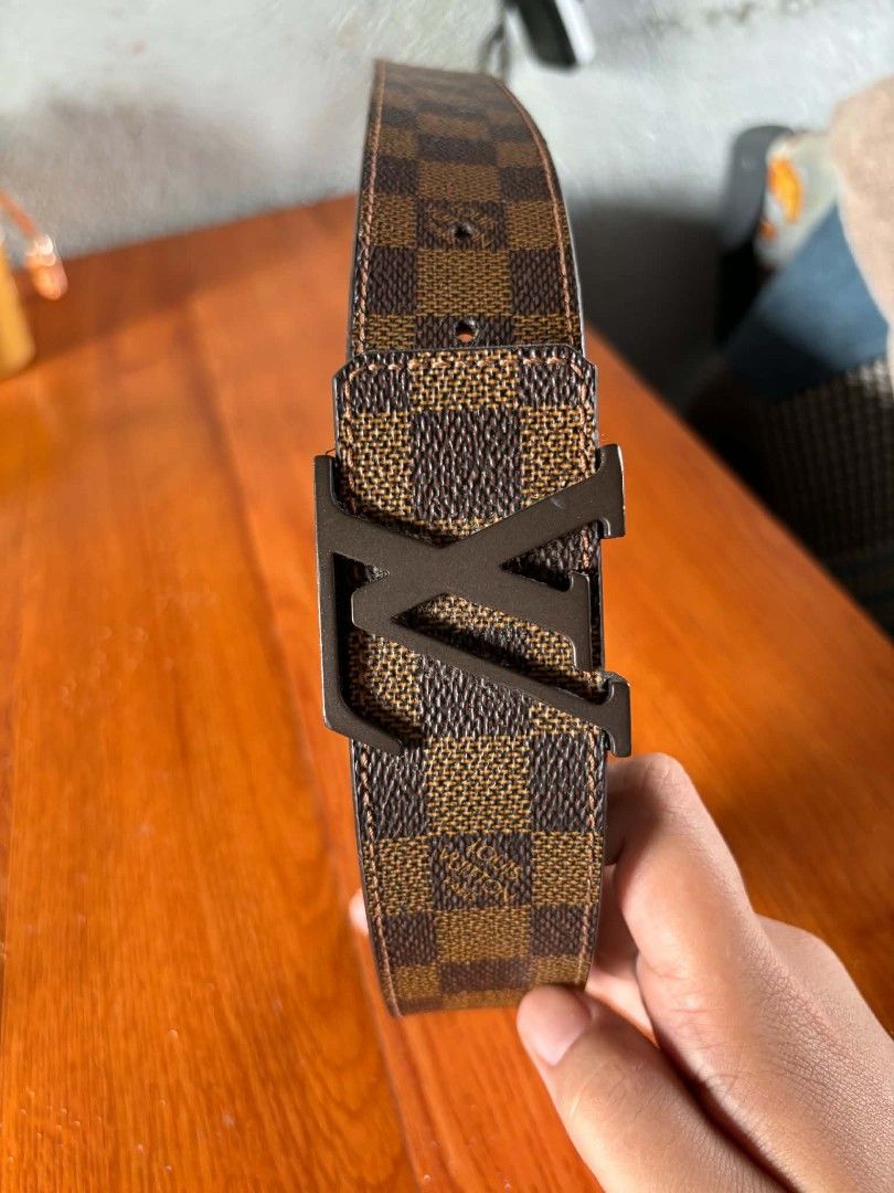 Louis Vuitton Damier Ebene LV Initiales Belt 95/38 (Category: Belts) located in Manila. Submitted by jessamarie95205 (Listing ID 1469889750, Image 2). Description: - Authentic Louis Vuitton Damier Ebene Canvas Belt - Size: 95 / 38 (Product Code: M0807) - Hardware: Sleek matte black LV buckle - Details: Classic brown leather backside with contrast stitching - Condition: Clean edges, sturdy build, and premium quality.