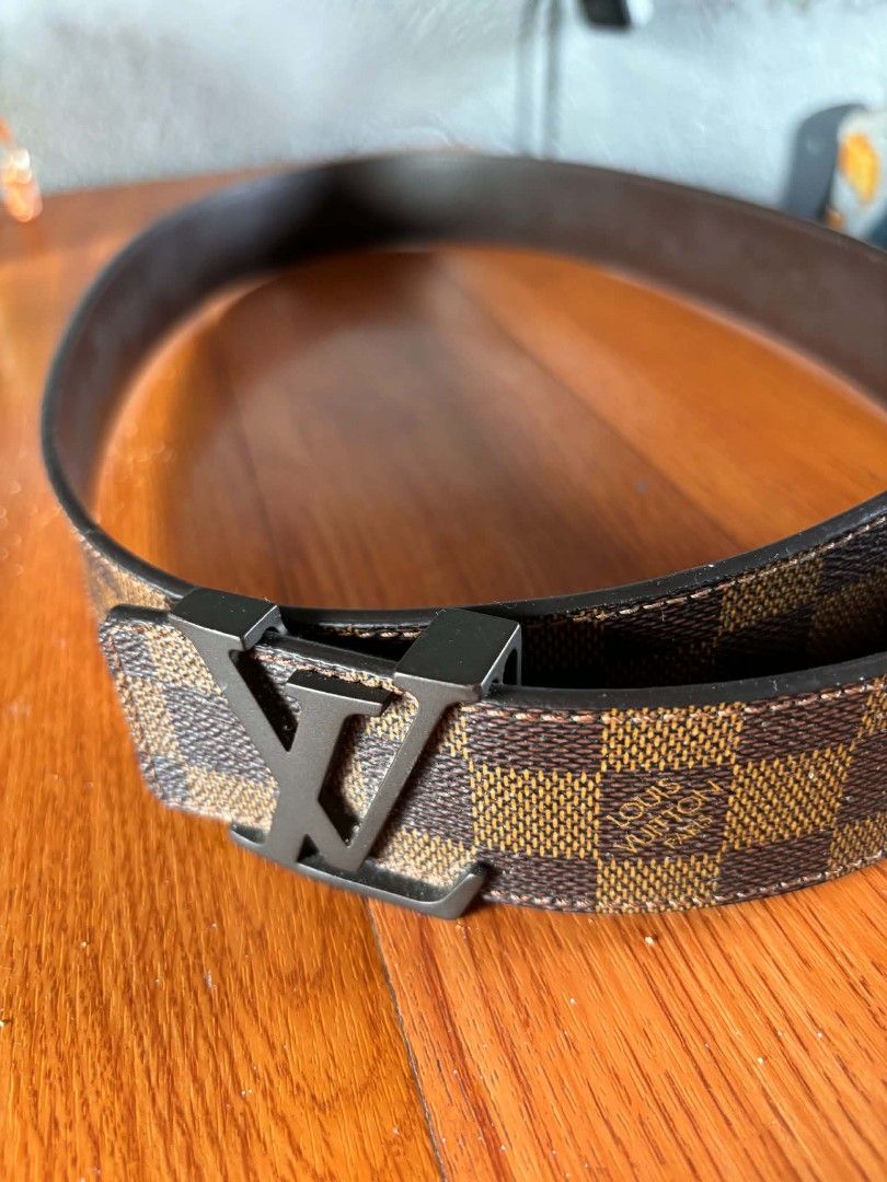 Louis Vuitton Damier Ebene LV Initiales Belt 95/38 (Category: Belts) located in Manila. Submitted by jessamarie95205 (Listing ID 1469889750, Image 1). Description: - Authentic Louis Vuitton Damier Ebene Canvas Belt - Size: 95 / 38 (Product Code: M0807) - Hardware: Sleek matte black LV buckle - Details: Classic brown leather backside with contrast stitching - Condition: Clean edges, sturdy build, and premium quality.