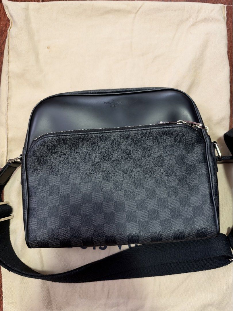 Louis Vuitton Damier Graphite Messenger Bag (Category: Luxury Bags & Wallets) located in Marikina City. Submitted by rctoby00 (Listing ID 1469935570, Image 2). Description: - Authentic Louis Vuitton Messenger Bag - Material: Damier Graphite canvas with black leather trim - Hardware: Silver-tone with dual zip closure - Strap: Adjustable black shoulder strap - Details: Louis Vuitton Paris hot stamp on front leather panel - Inclusion: Dust bag inclu