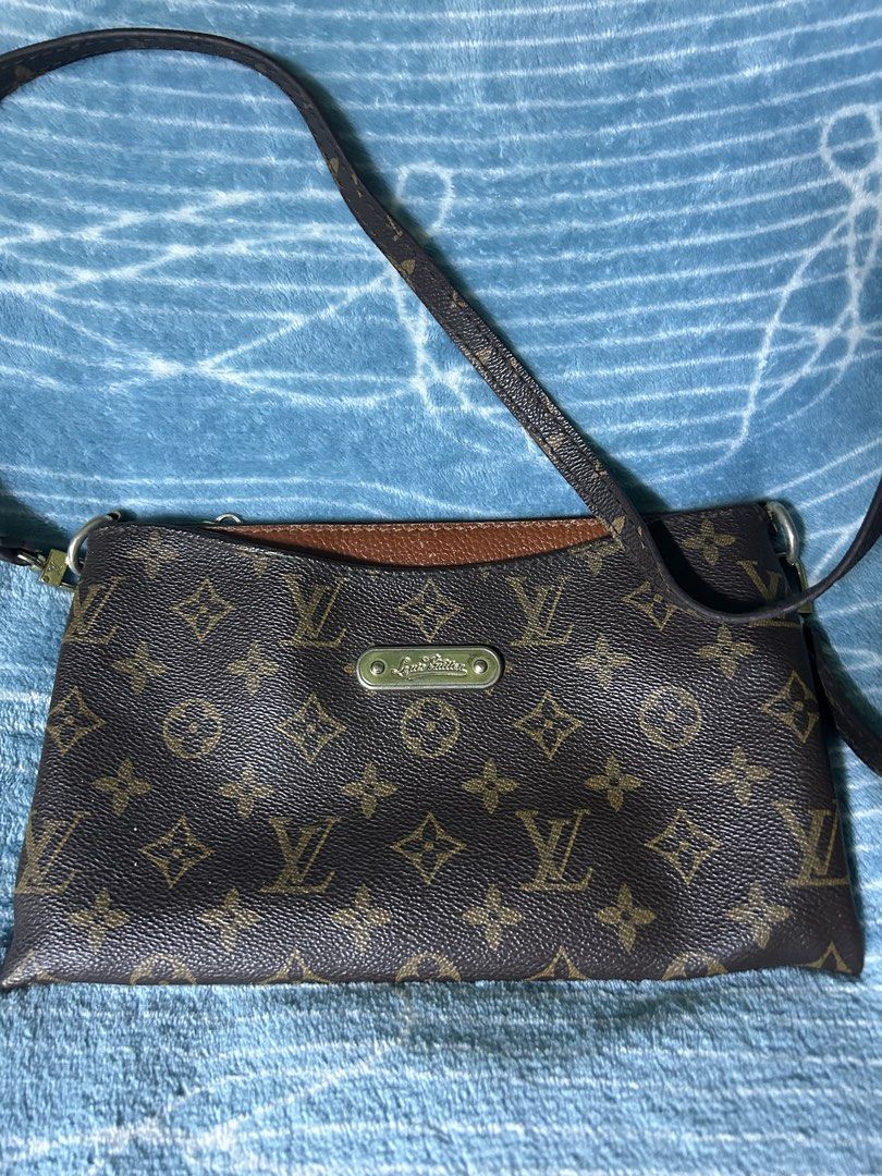 Louis Vuitton Monogram Canvas Crossbody Bag (Category: Cross-body Bags) located in Quezon City. Submitted by thriftxgoods (Listing ID 1469897227, Image 2). Description: Louis Vuitton Monogram canvas crossbody bag. Brown monogram pattern with structured silhouette and long adjustable strap. Front features a gold-tone metallic plaque embossed with Louis Vuitton signature. Zippered top closure plus an exterior zip pocket on the back. Interior lined 