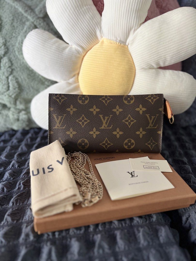 Louis Vuitton Monogram Pochette Accessories Pouch (Category: Luxury Bags & Wallets) located in Batangas. Submitted by kashieca_41 (Listing ID 1469788889, Image 1). Description: - Authentic Louis Vuitton monogram canvas pouch - Classic brown LV print with signature cowhide leather tab - Comes complete with box, dust bag, and tags - Includes a free non-brand gold-tone chain strap for shoulder or crossbody wear - Versatile everyday piece that fits s
