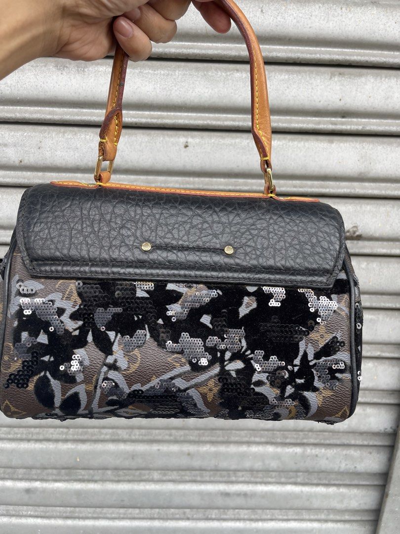 Louis Vuitton Monogram Sequin Flap Handbag (Category: Luxury Bags & Wallets) located in Quezon City. Submitted by karma_para_sa_bogus (Listing ID 1469817140, Image 2). Description: Louis Vuitton handbag combining monogram canvas, textured black leather flap, and dark sequin floral embroidery. Gold-tone front lock closure, leather top handle, and four bottom studs. Brown fabric lining inside with date code stamp TJ2150 and heritage label pocket. S