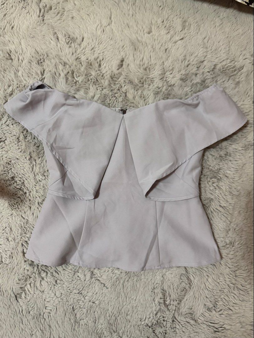 Love Bonito Off-Shoulder Ruffle Top (Category: Sleeveless) located in Calamba. Submitted by cheriiv (Listing ID 1469911237, Image 3). Description: - Brand/Model: Love Bonito off-shoulder top - Color: Light grey - Size: M (Fits UK 10 / US 6) - Design: Front flap overlays, structured pleats, exposed back zipper - Material: Smooth, slightly weighted fabric for a premium structure.