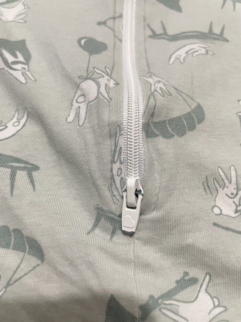 Love To Dream Swaddle Up Transition Bag Lite Medium (Category: Breastfeeding & Bottle Feeding) located in San Jose del Monte. Submitted by momma_buys (Listing ID 1469830159, Image 3). Description: - Brand: Love To Dream Swaddle Up Transition Bag Lite - Size: Medium (00), fits babies 6-8.5 kgs / 13-19 lbs (approx. 3-6 months) - Material: 97% cotton, 3% elastane (ideal for warm weather) - Design: Grey with playful bunny pattern and striped wing sle