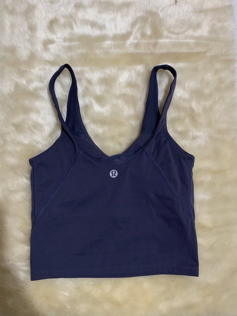 Lululemon Align Tank Top Dark Purple (Category: Activewear) located in Bayombong. Submitted by birkensaddiction (Listing ID 1469883739, Image 2). Description: - Brand: Lululemon - Item: Athletic crop top - Color: Dark purple - Support: Built-in bra cups included - Design: V-neckline with trendy back strap details and signature logo on the back band - Fabric: Super soft and comfortable - Ideal for: Yoga, gym workouts, or everyday casual wear Dot 4