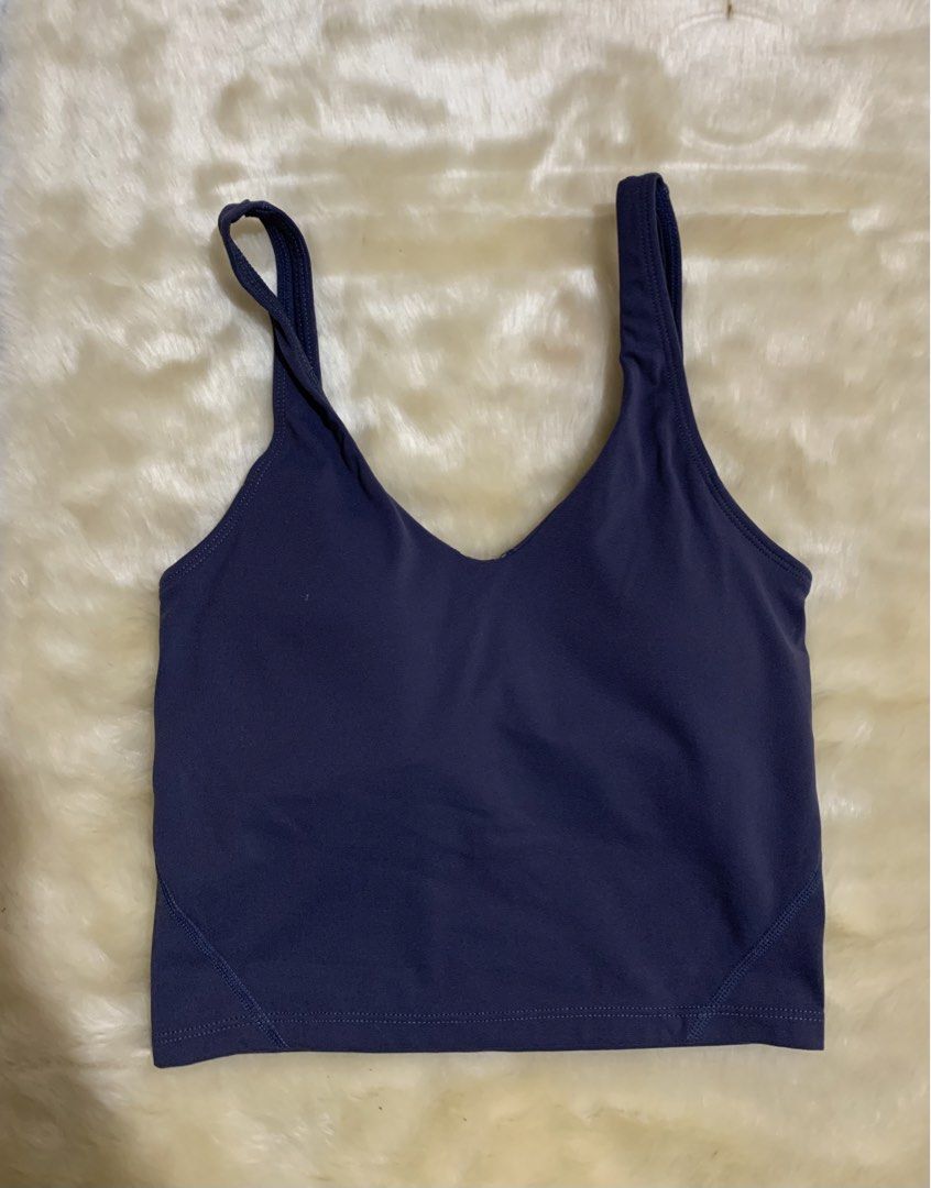 Lululemon Align Tank Top Dark Purple (Category: Activewear) located in Bayombong. Submitted by birkensaddiction (Listing ID 1469883739, Image 1). Description: - Brand: Lululemon - Item: Athletic crop top - Color: Dark purple - Support: Built-in bra cups included - Design: V-neckline with trendy back strap details and signature logo on the back band - Fabric: Super soft and comfortable - Ideal for: Yoga, gym workouts, or everyday casual wear Dot 4