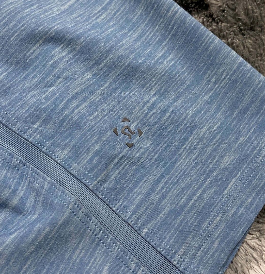 Lululemon Blue Athletic Shorts Size L (Category: Shorts) located in Sorsogon. Submitted by johnmichae69459 (Listing ID 1469812223, Image 3). Description: - Brand: Lululemon - Color: Blue Heathered - Size: Large - 32 to 36 waistline - 19 lenght - Waistband: Elastic with adjustable drawstring - Pockets: Secure zippered side pockets - Details: Iconic Lululemon logo on leg and hardware - Material: Lightweight stretch fabric - Condition: Excellent, re