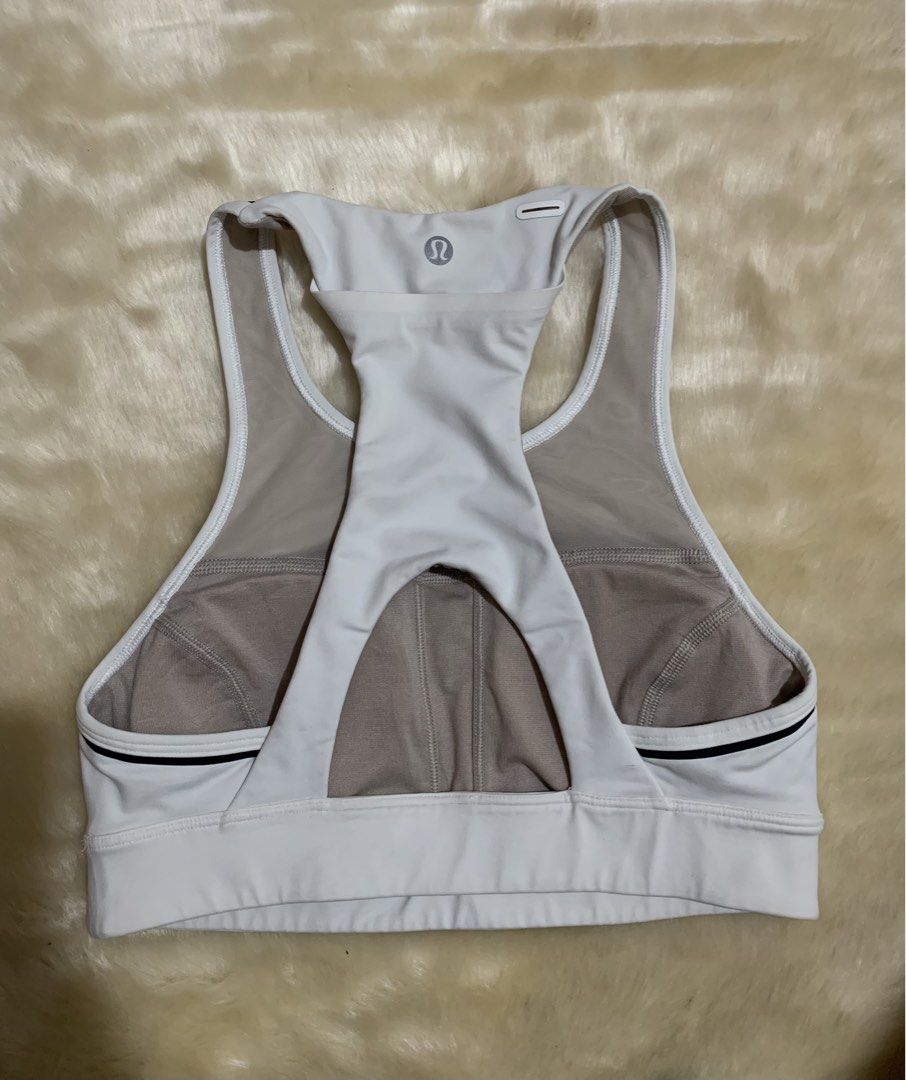 Lululemon Energy Bra White Black Size 4 (Category: Activewear) located in Bayombong. Submitted by birkensaddiction (Listing ID 1469884035, Image 2). Description: - Authentic Lululemon Energy Bra in crisp white - Chic black trim stripes along the straps - Neutral taupe/beige mesh lining for breathability - Racerback design with a stylish keyhole cutout - Reflective logo detail near the top back - Size: 4 (verified via interior size dot) - Ideal su