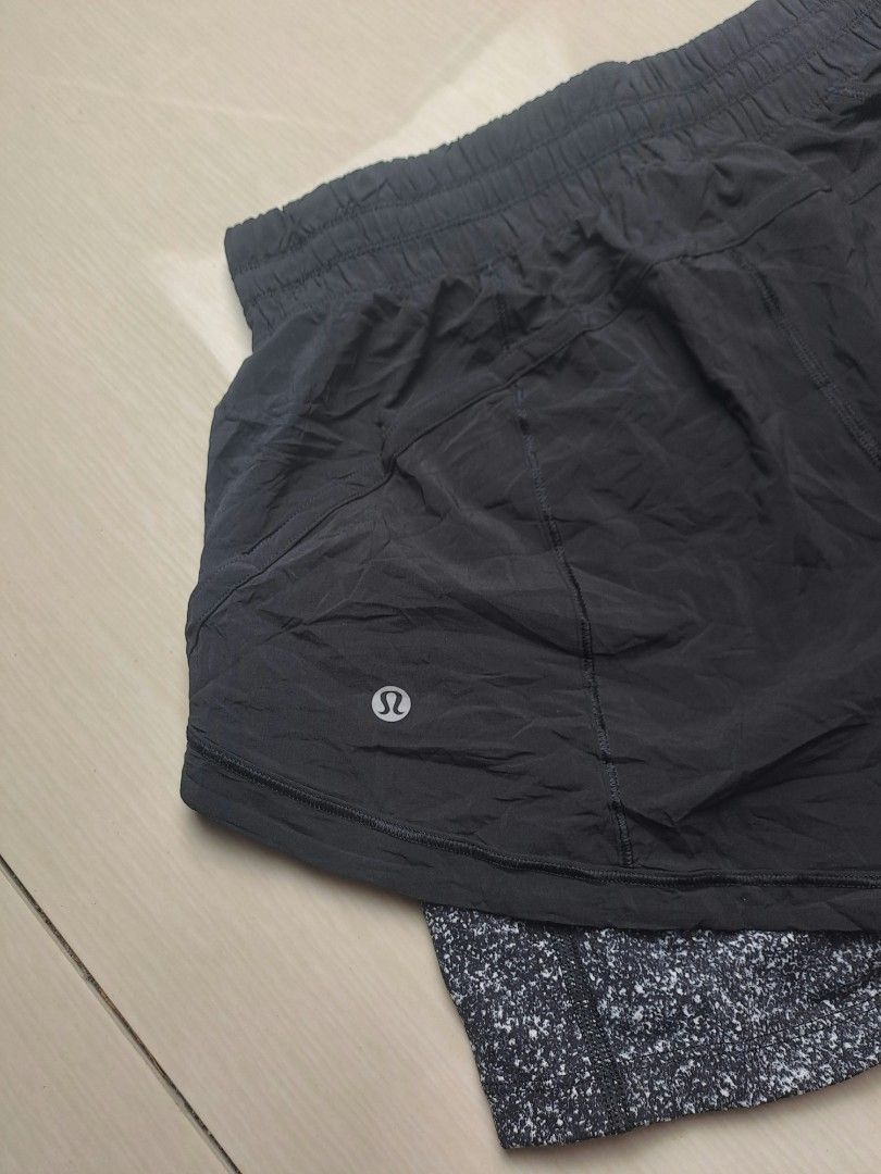 Lululemon Shorts with Speckled Liner (Category: Shorts) located in General Santos City (Dadiangas). Submitted by shinra322 (Listing ID 1469833845, Image 2). Description: - Brand: Lululemon - W26-30 L13.5 - Color: Solid black with grey-and-white speckled liner - Fit: Built-in drawstring waistband for adjustable comfort - Material: Lightweight, breathable fabric ideal for running and workouts - Details: Signature Lululemon logo printed on the back 