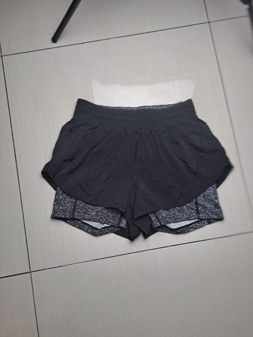 Lululemon Shorts with Speckled Liner (Category: Shorts) located in General Santos City (Dadiangas). Submitted by shinra322 (Listing ID 1469833845, Image 3). Description: - Brand: Lululemon - W26-30 L13.5 - Color: Solid black with grey-and-white speckled liner - Fit: Built-in drawstring waistband for adjustable comfort - Material: Lightweight, breathable fabric ideal for running and workouts - Details: Signature Lululemon logo printed on the back 