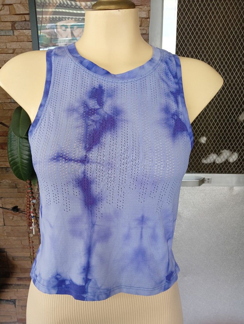 Lululemon Tank Top (Category: Activewear) located in Rizal. Submitted by timeless_shop (Listing ID 1469817075, Image 3). Description: Original Lululemon Trained to Be Tank Size 6 📏 Size: Dot 6 📝 Details: - Length: 19 inches - Width: 16 inches flat laid - Fabric: Breathable, light & quick-dry - Design: Tie dye pattern + side slit - Style: Relaxed fit, nice color too Condition: 9.9/10 - Like New Almost - No stain , No issue - Color Rate: 9.9/10 -