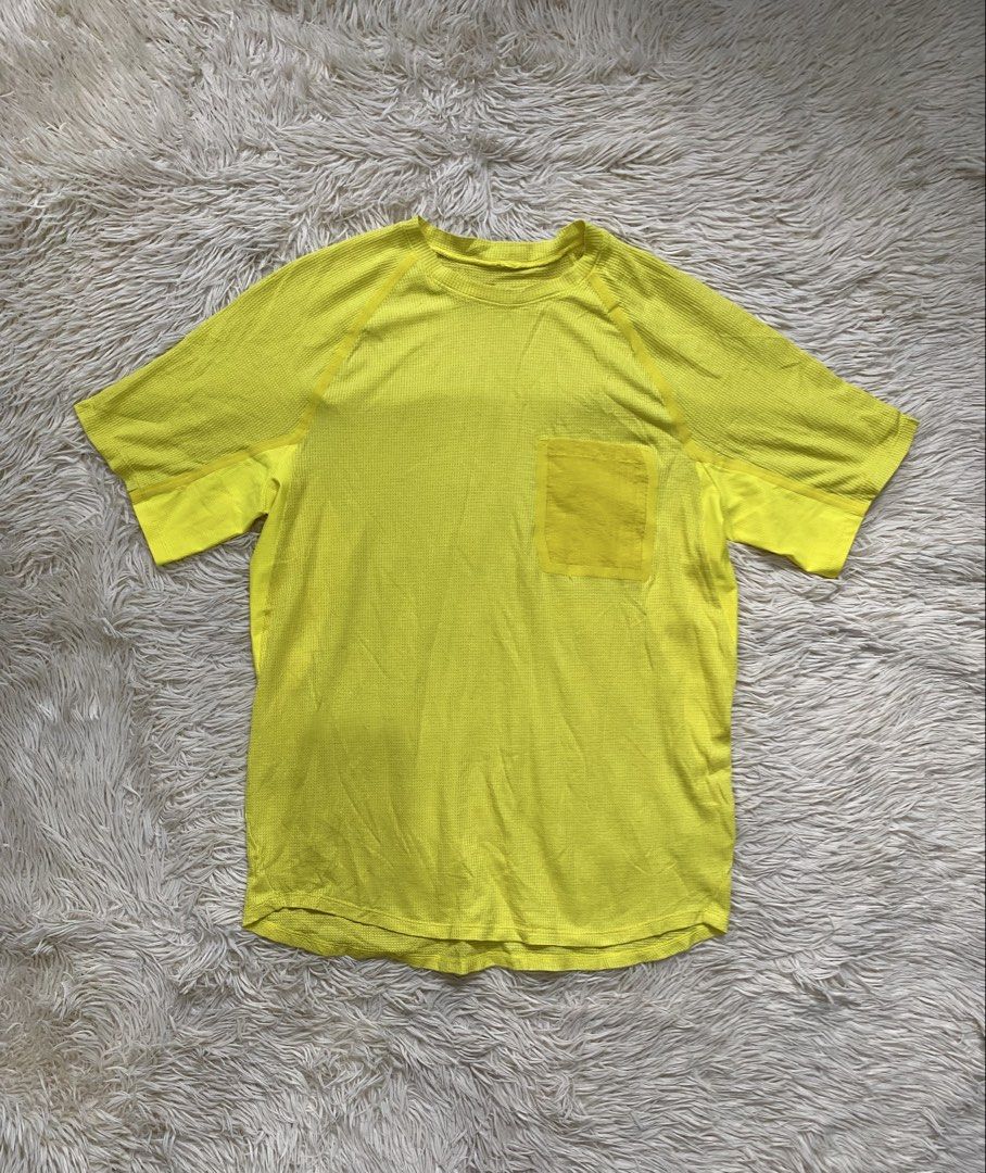 Lululemon ventilated pocket tee (Category: Tshirts & Polo Shirts ) located in Antipolo. Submitted by switchneighborhood (Listing ID 1469818266, Image 2). Description: Lululemon athletic tee in bright yellow. Short sleeves, textured waffle knit fabric, crew neckline. Handy chest pocket on the left side. Black lululemon logo patch near the bottom hem on the back. Regular fit, great breathable material for workouts or casual wear..