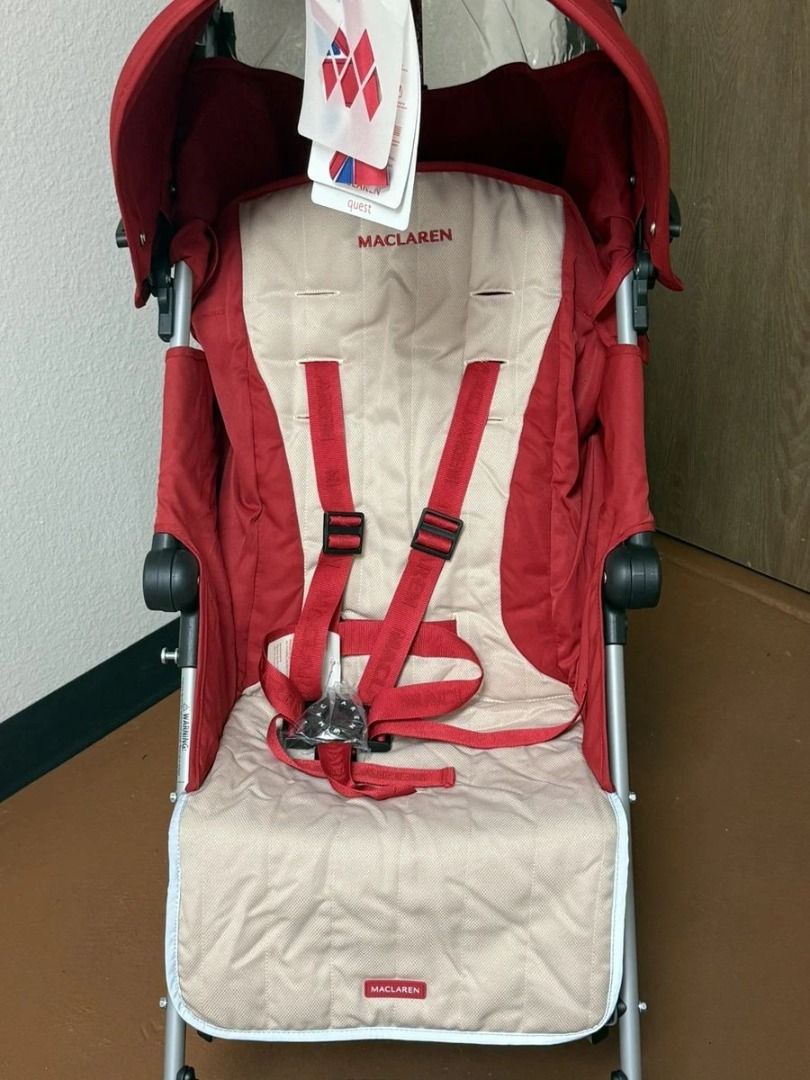Maclaren Quest Stroller Red and Beige (Category: Strollers) located in Manila. Submitted by vashtardo (Listing ID 1469932844, Image 1). Description: - Brand: Maclaren Quest stroller - Colorway: Red and beige - Condition: Like new, original tags still attached on handlebars - Design: Lightweight, foldable umbrella style for easy carrying - Features: Attached canopy, safety harness straps, and back storage pocket - Performance: Smooth-rolling wheel
