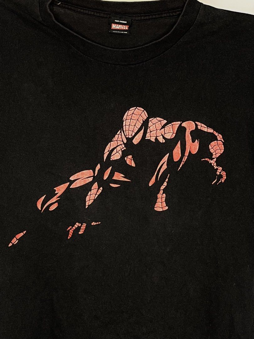 Mad Engine Marvel Spider-Man Black Graphic T-Shirt (Category: Tshirts & Polo Shirts ) located in Cavite. Submitted by ozzyozzx (Listing ID 1469881330, Image 3). Description: - Authentic Mad Engine x Marvel Spider-Man t-shirt - Color: Black - Graphic: Spider-Man crouching pose with red web pattern - Fit: Short sleeves, crew neck collar - Details: Official branding and Marvel website URL on tag - Style: Casual wear for everyday use.