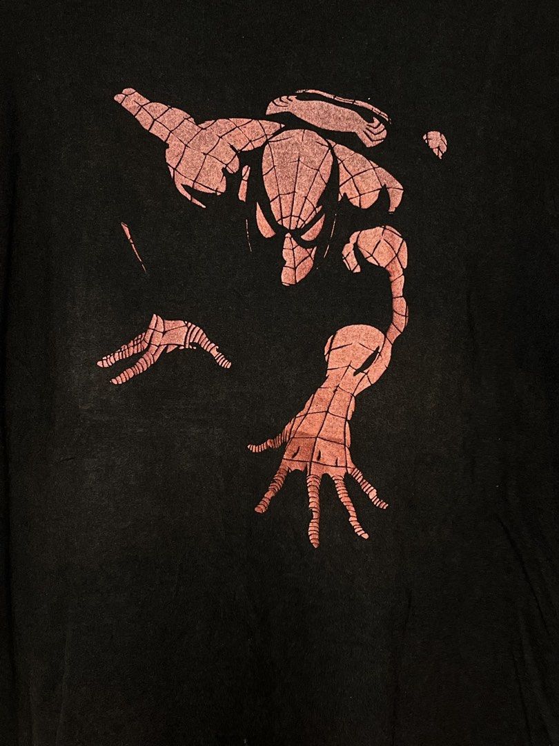 Mad Engine Marvel Spider-Man Graphic T-Shirt Black (Category: Tshirts & Polo Shirts ) located in Cavite. Submitted by ozzyozzx (Listing ID 1469881265, Image 2). Description: - Brand/Collab: Official Mad Engine x Marvel - Design: Classic red web-slinging Spider-Man graphic on the chest - Color/Style: Vintage faded black cotton wash with a worn-in look - Fit: Standard fit, short sleeves, crew neck collar - Condition: Great vintage condition, tagged