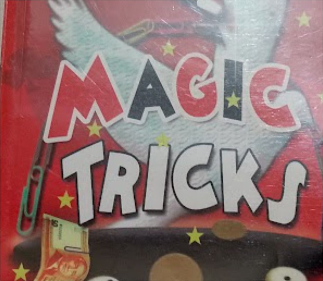 Magic Tricks Instruction Book (Category: Children's Books) located in Quezon City. Submitted by susmaryosep1 (Listing ID 1469877003, Image 3). Description: - Title: Magic Tricks (Hardcover) - Cover features a classic magic illustration (dove, top hat, dice, coins, and paper money) - Condition: Pages intact, sturdy spine - Ideal for beginners and aspiring magicians of all ages - Great guide to learning cool and impressive illusions 150.
