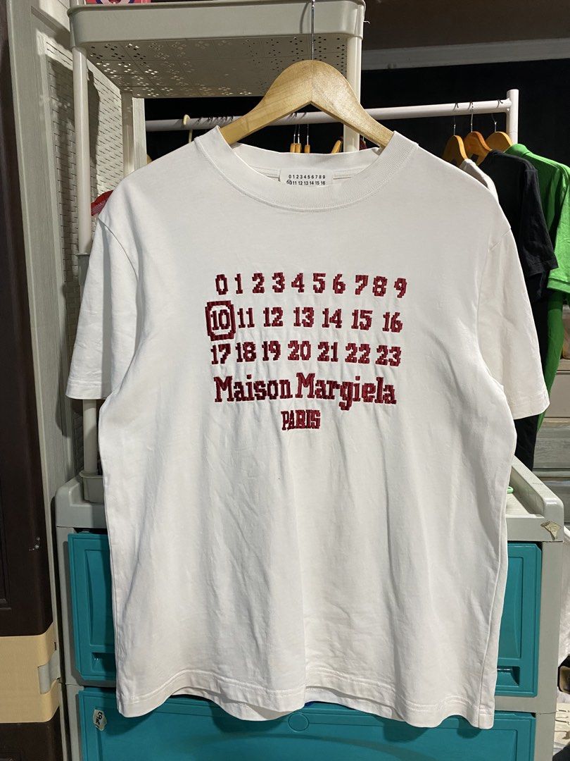 Maison Margela Tee (Category: Luxury Apparel) located in Munoz. Submitted by brazziwardrobe (Listing ID 1469908194, Image 1). Description: Length:26 inches Width:20 inches Very Good Condition Color rate:9.8/10 issue:dot stains , Yellow stains, slightly bacon neck.