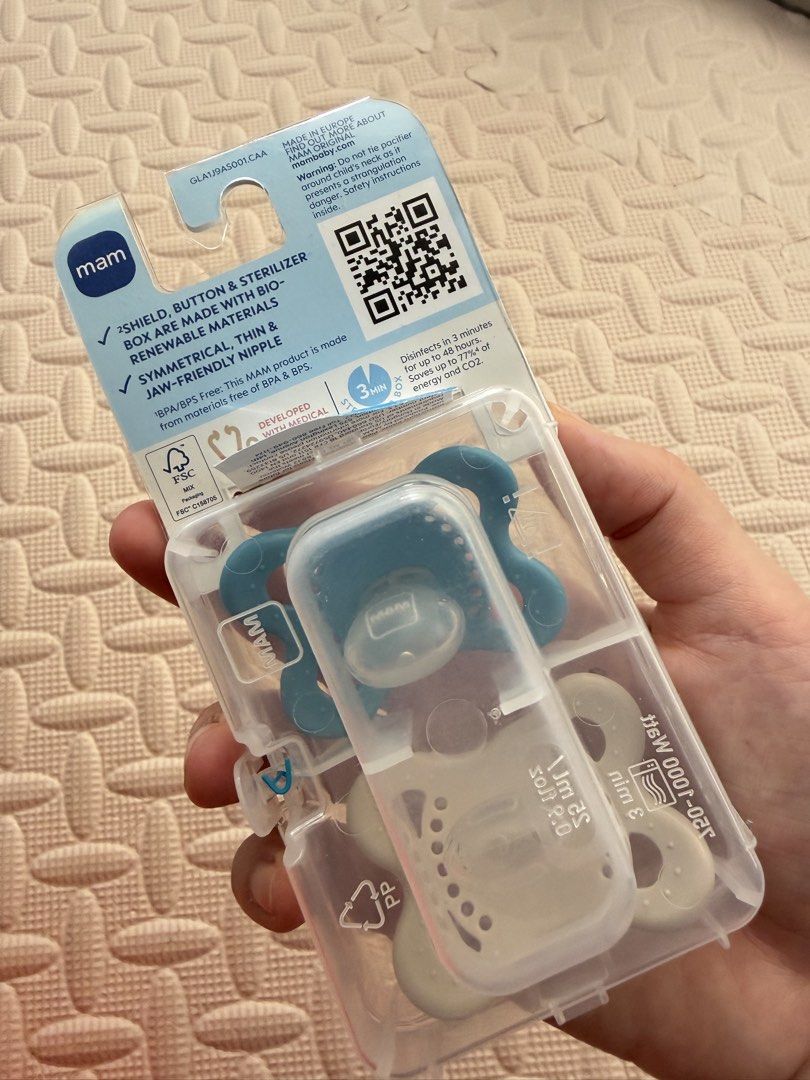 MAM Original Night Pacifier 0-6 Months 2 Pack (Category: Soothers & Pacifiers) located in Quezon City. Submitted by marifavo (Listing ID 1469826739, Image 2). Description: - Age: 0-6 months (2-pack) - Glows in the dark for easy nighttime finding - Skin-soft silicone material - 100% BPA and BPS free - Includes self-sterilizing travel box - Condition: Brand new, unopened, and pristine.