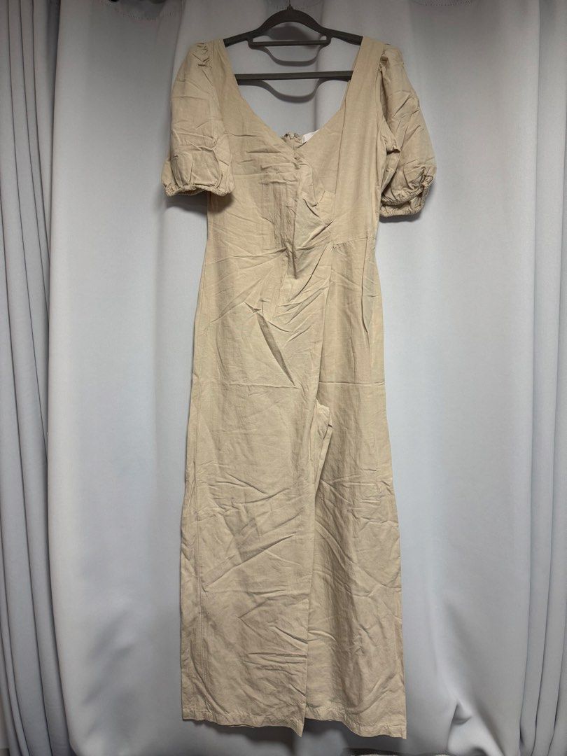 Mango Jumpsuit with Puff Sleeves (Category: Jumpsuits) located in Calamba. Submitted by cheriiv (Listing ID 1469785362, Image 3). Description: Worn once - Color: Neutral beige - Style: Short puff sleeves, crossover wrap front, V-neckline, and wide legs - Closure: Convenient back zip - Material: Light, comfortable fabric - Versatility: Perfect for both casual days and dressy occasions.