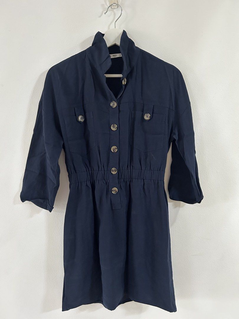 Mango navy blue mini dress (Category: Dresses) located in Manila. Submitted by isabelle_1104 (Listing ID 1469921619, Image 1). Description: - Brand/Style: MNG Casual Dark Blue Utility Shirt Dress - Size: Small (US 4) - Design: Funnel neck collar, button-down front with tortoiseshell buttons - Details: Two chest flap pockets, three-quarter sleeves - Waist: Elasticated waist for a comfortable and easy fit - Origin: Made in Vietnam - Material: Light