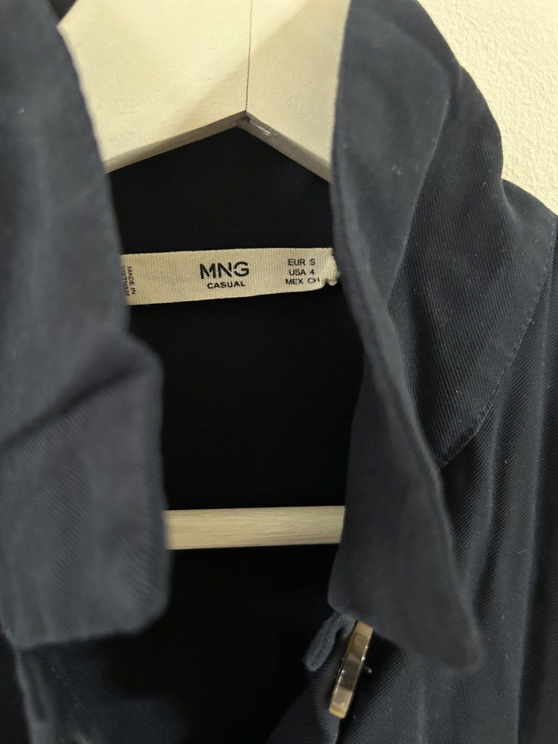 Mango navy blue mini dress (Category: Dresses) located in Manila. Submitted by isabelle_1104 (Listing ID 1469921619, Image 2). Description: - Brand/Style: MNG Casual Dark Blue Utility Shirt Dress - Size: Small (US 4) - Design: Funnel neck collar, button-down front with tortoiseshell buttons - Details: Two chest flap pockets, three-quarter sleeves - Waist: Elasticated waist for a comfortable and easy fit - Origin: Made in Vietnam - Material: Light