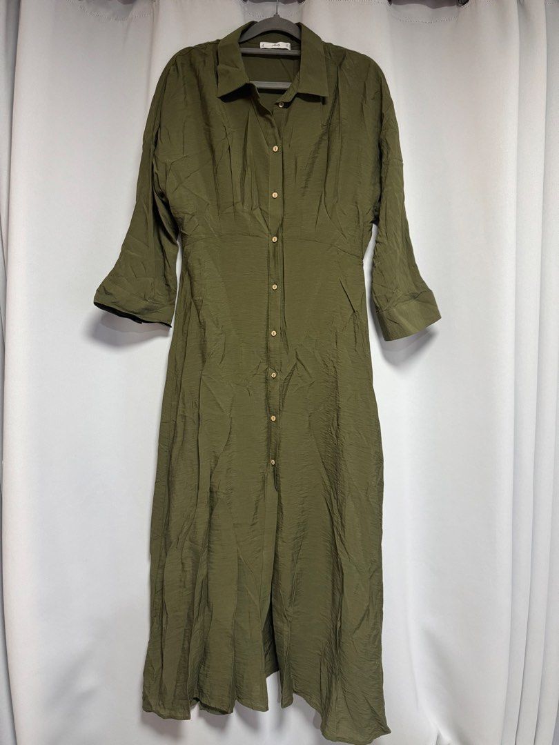 Mango Olive Green Shirt Dress Medium (Category: Dresses) located in Calamba. Submitted by cheriiv (Listing ID 1469788243, Image 1). Description: Washed, never worn - Brand: MNG - Style: Olive green midi shirt dress with button-up front, collar, and 3/4 sleeves - Fit: Fitted waist seam, lightweight fabric - Size: EUR M / USA 6 / MEX M - Versatility: Perfect for daily casual wear or office outfits.