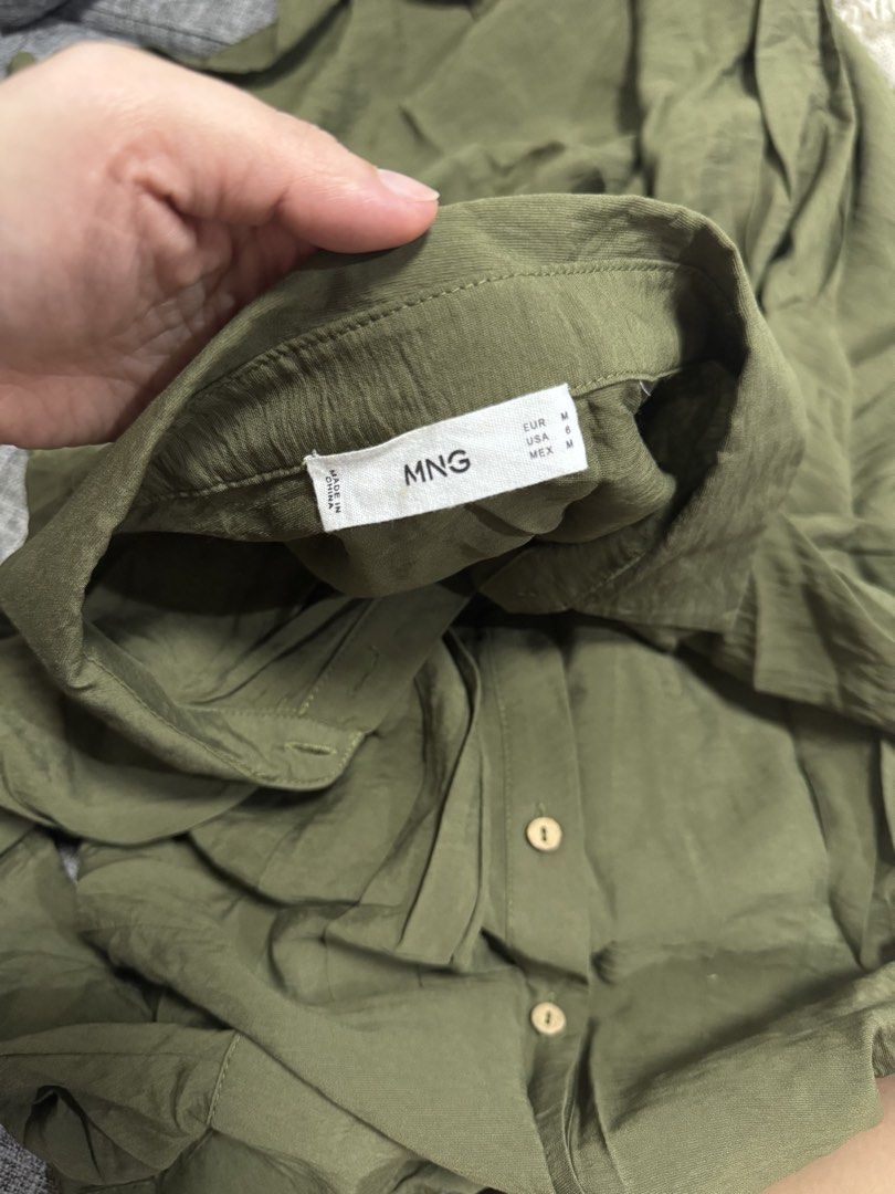 Mango Olive Green Shirt Dress Medium (Category: Dresses) located in Calamba. Submitted by cheriiv (Listing ID 1469788243, Image 3). Description: Washed, never worn - Brand: MNG - Style: Olive green midi shirt dress with button-up front, collar, and 3/4 sleeves - Fit: Fitted waist seam, lightweight fabric - Size: EUR M / USA 6 / MEX M - Versatility: Perfect for daily casual wear or office outfits.