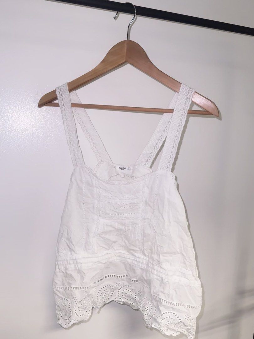 Mango White Top (Category: Blouses) located in Quezon City. Submitted by coolmomma (Listing ID 1469864800, Image 2). Description: Good condition but has minimal flaw barely noticable see last photo length 23 in. from shoulder fits small to medium.
