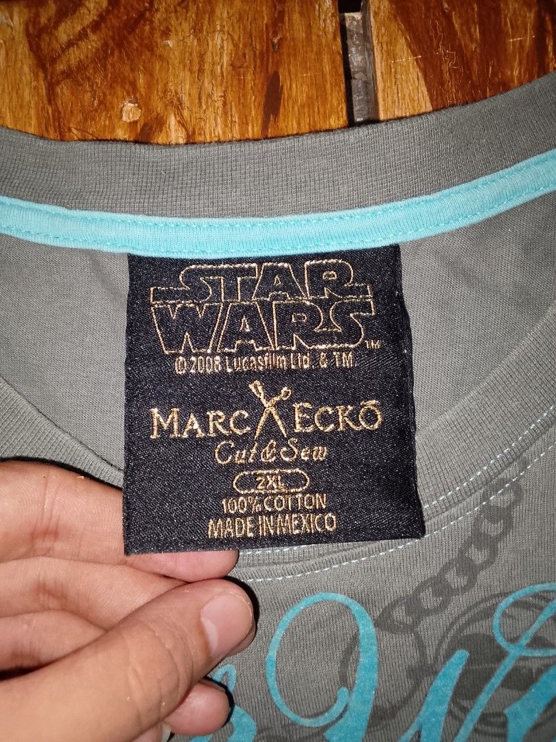 Marc Ecko Star Wars Stormtrooper T-Shirt 2XL (Category: Tshirts & Polo Shirts ) located in Gapan. Submitted by alfiesimon43550 (Listing ID 1469874652, Image 3). Description: - StarWars - Brand: Marc Ecko Cut & Sew (Official 2008 Lucasfilm merch) - Design: Large Stormtrooper graphic with wings, roses, and all-over chain print - Color: Gray with light blue neckline trim - Size: 2XL - Material: 100% Cotton (Made in Mexico) - Condition: Excellent pre