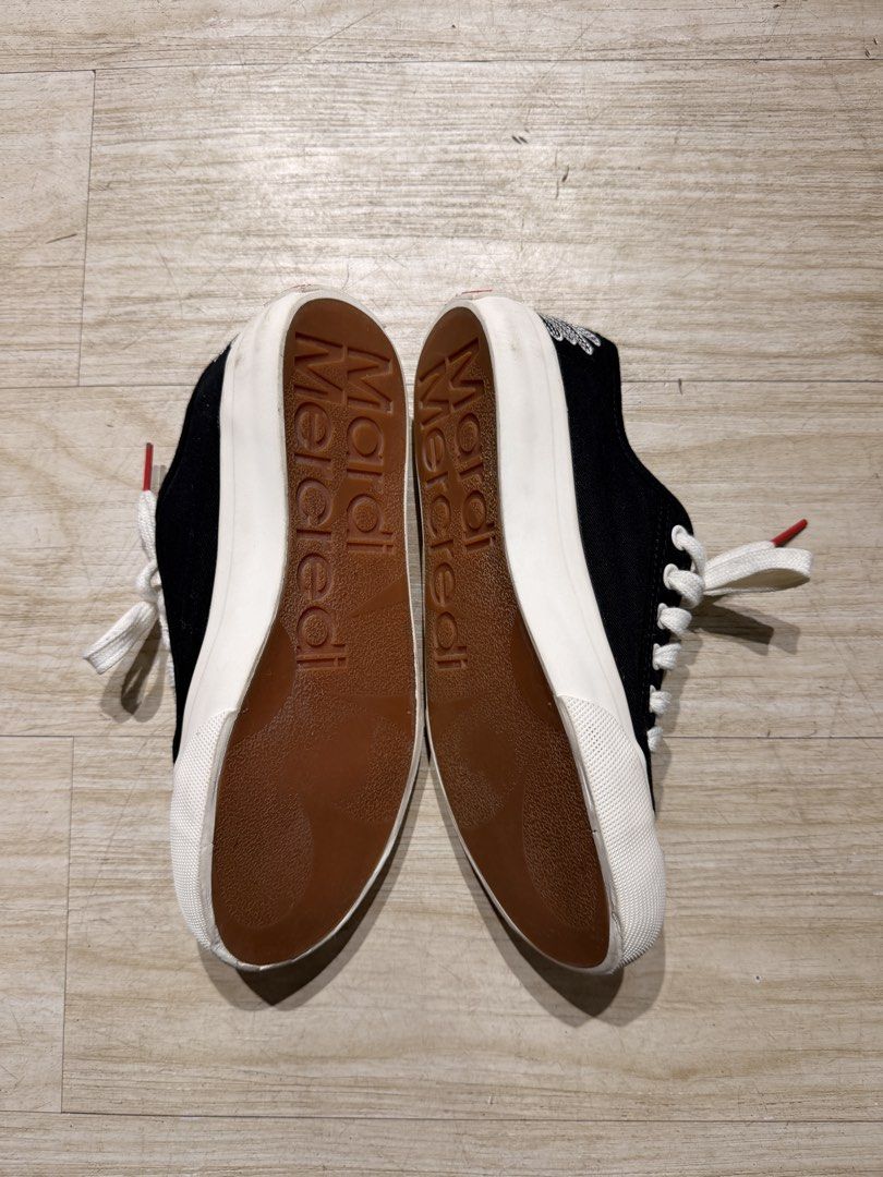 Mardi Mercredi Black Canvas Sneakers (Category: Sneakers) located in Davao. Submitted by _jetnest25 (Listing ID 1469874151, Image 2). Description: - Brand: Mardi Mercredi - Color: Black canvas with white rubber toe caps and midsoles - Design Details: Iconic embroidered flower on the heel, contrast red-tipped laces, and brown gum soles with embossed branding - Condition: Like new, only worn a couple of times with fresh uppers and soles - Inclusion