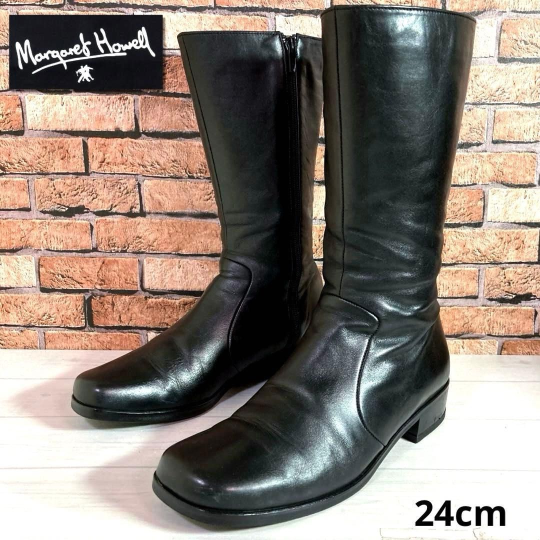 Margaret Howell Black Leather Boots (Category: Boots) located in General Mariano Alvarez. Submitted by kascade (Listing ID 1469888585, Image 1). Description: - Brand: Margaret Howell - Origin: Made in Japan - Size: 24cm (Fits local Women’s 7 to 7.5) - Style: Classic knee-high, minimalist design with side zippers - Material: Smooth black leather upper - Heel: Comfortable low block heel - Inclusions: No original box included - Great for: Everyday v