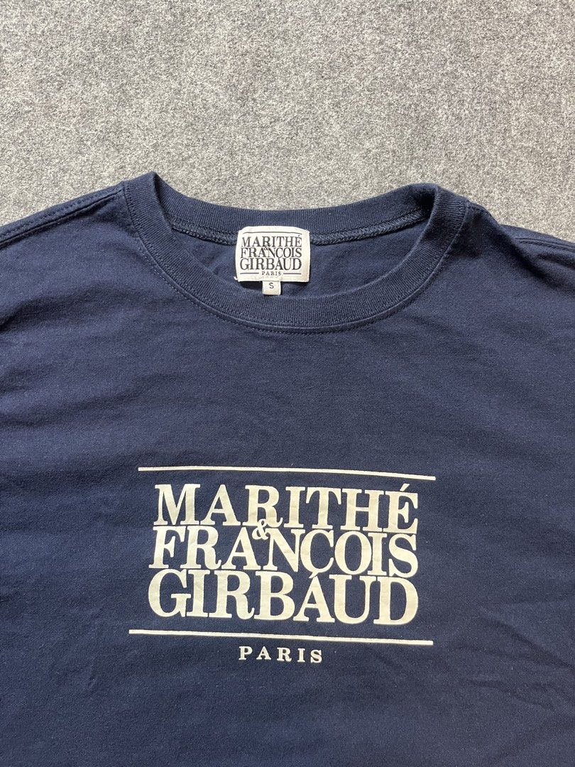 Marithe Francois Girbaud Navy Crop T-Shirt Size S (Category: Shirts) located in Lapu Lapu. Submitted by softfind (Listing ID 1469822717, Image 2). Description: - Brand: Marithe Francois Girbaud - Color: Navy Blue - Size: Small (S) with original woven neck label and inner tag - Design: White box graphic print with Paris branding on the front - Cut: Cropped fit, short sleeves, and crew neckline.