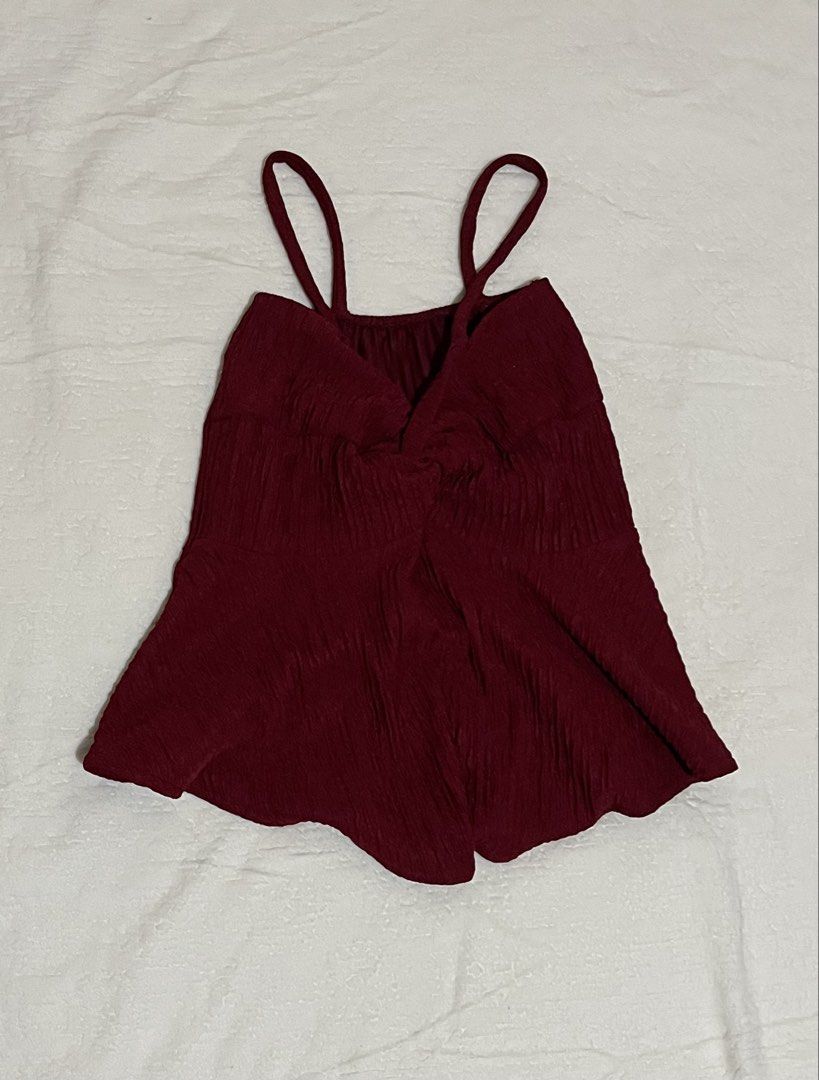 maroon babydoll top xs-s (Category: Blouses) located in Manila. Submitted by yours_eventually (Listing ID 1469907126, Image 2). Description: - Color: Maroon - Style: Cami babydoll top with spaghetti straps and a flared hem - Details: Textured crinkled fabric with a gathered twist front - Size: Fits extra small to small frames comfortably - Condition: Clean and ready to wear.
